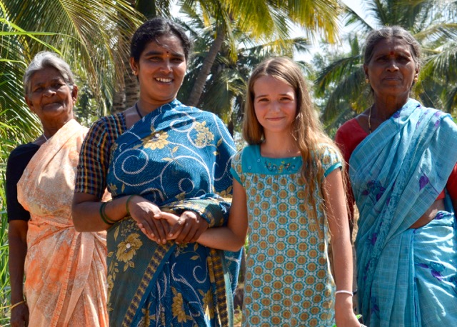 Lovena's daughter Asha with a woman farmer and her mother in India